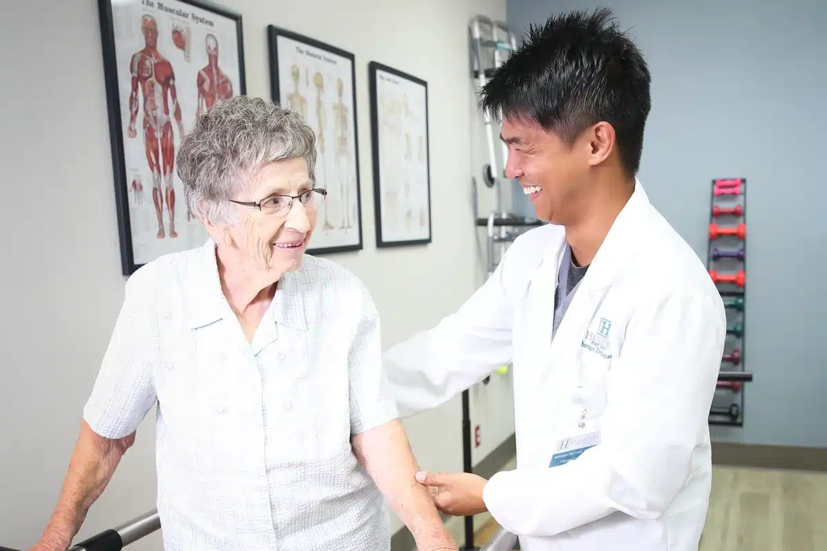 PACS-300x200-woundcare A therapist and an older woman in the rehab gym at Hanford Post Acute