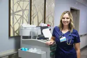 A nurse at a nurse's cart at Hanford Post Acute