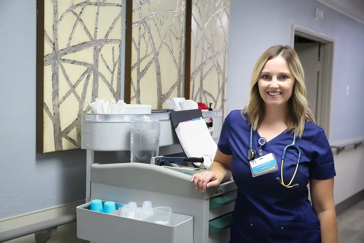 A nurse at a nurse's cart at Hanford Post Acute